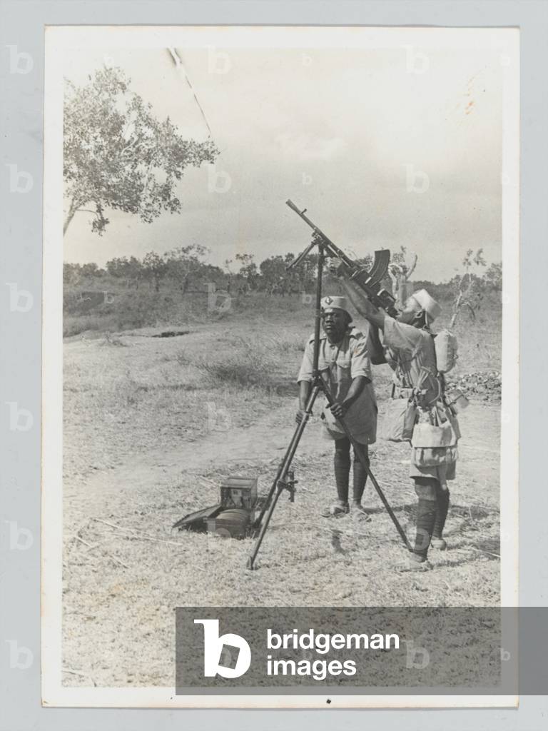 Soldiers of the 4th (Uganda) Battalion, Kings African Rifles, manning a Bren gun in anti-aircraft configuration, 1939 (b/w photo)