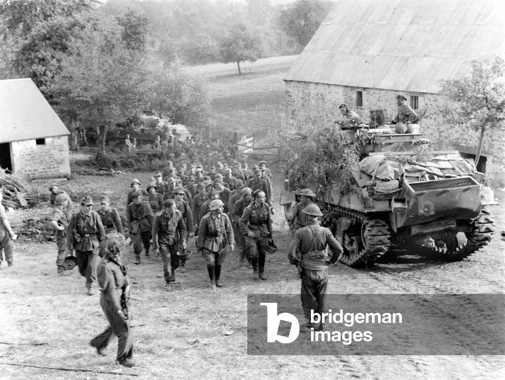 German POWs marching past a Sherman tank, Normandy, 1944 (b/w photo)