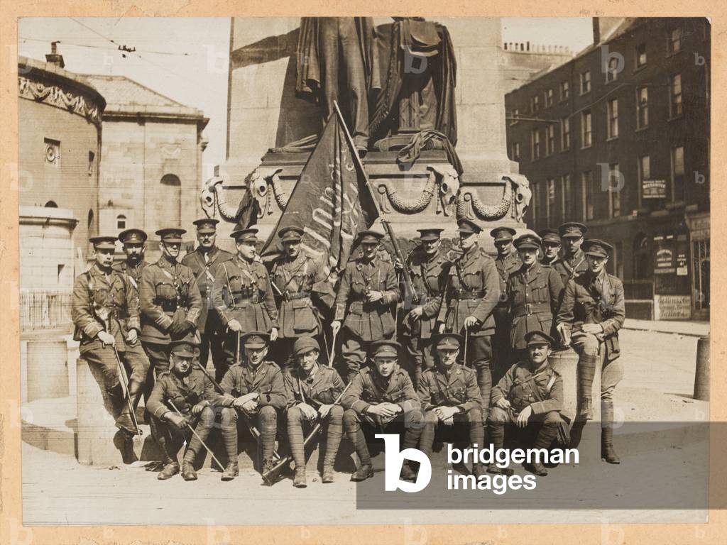 Officers of 3rd Battalion The Royal Irish Regiment with a captured Sinn Fein flag, Easter 1916 (b/w photo)