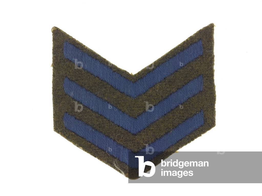 One of a pair of chevrons, service (blue), associated with L/Cpl J R Dixon, 12th (County of London) Bn The London Regiment (The Rangers), c.1917 (textile)