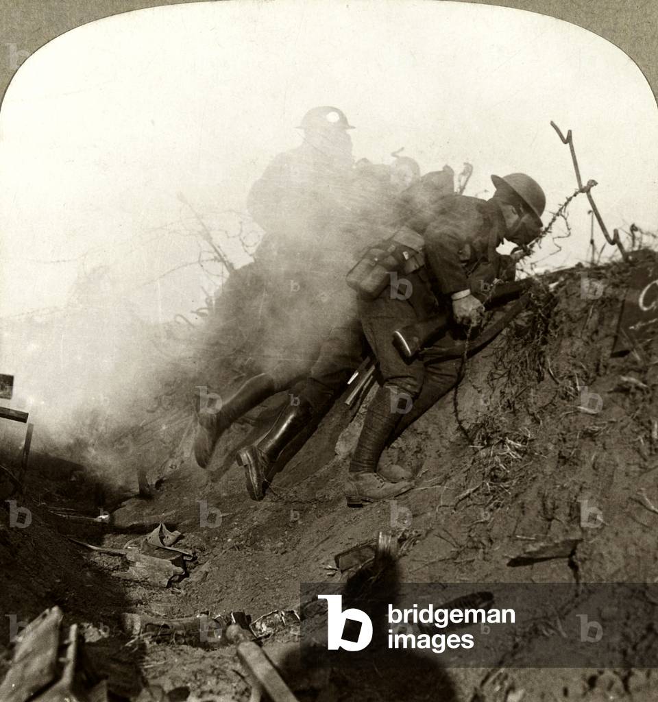 Over the top, amid bursting shells and tear gas, in a determined assault on the fortified Somme villages, 1916 (b/w photo)
