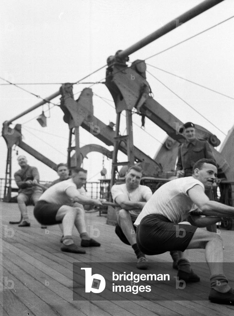 Tug of War. HQ Team, 3rd County of London Yeomanry (Sharpshooters) on board HMT Orion en route to Egypt, 1941 (b/w photo)