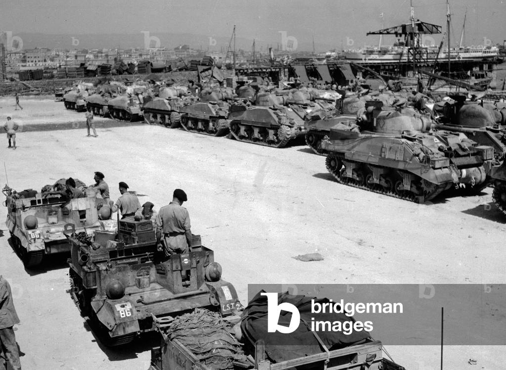 Vehicles waiting to load at Catania, 1943 (b/w photo)