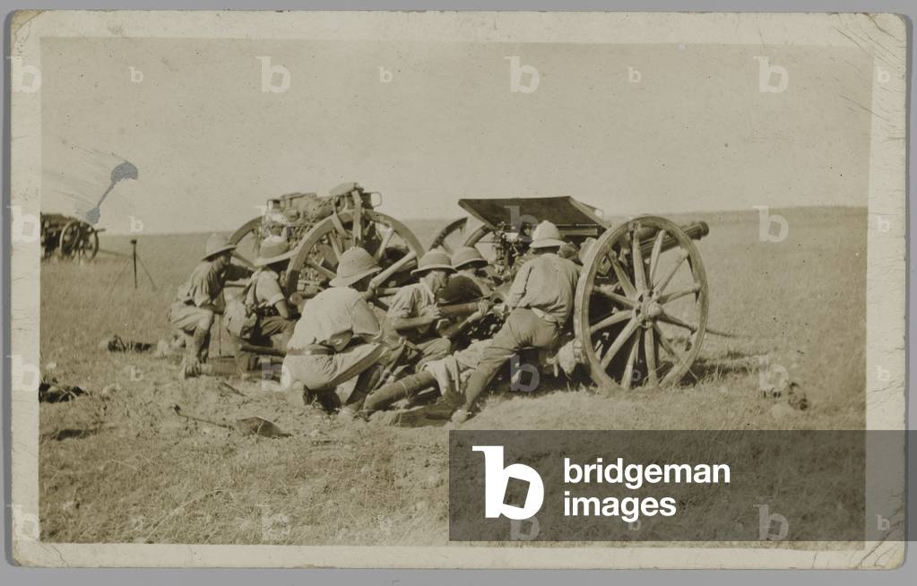 Postcard photograph of a gun crew loading a 13 pounder field gun, Royal Horse Artillery, Egypt, 1915 (b/w photo)
