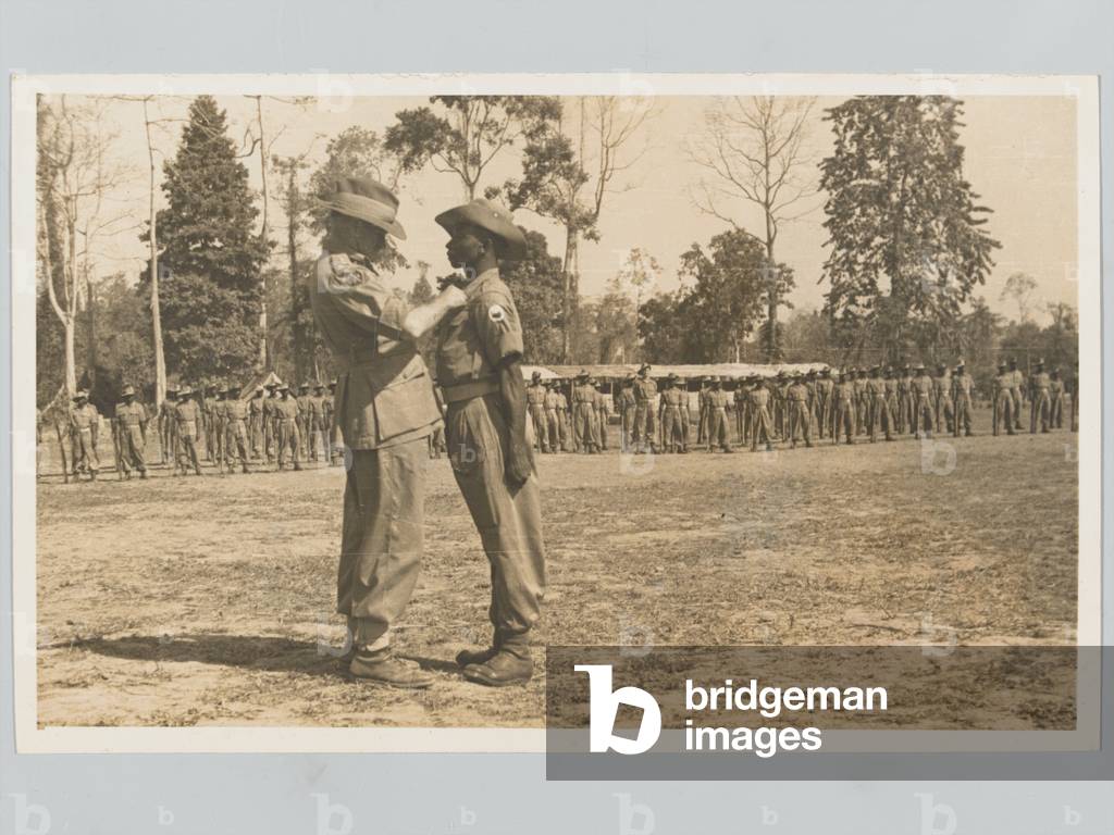 General Slim presenting a gallantry award to an African soldier, 1945 circa (b/w photo)