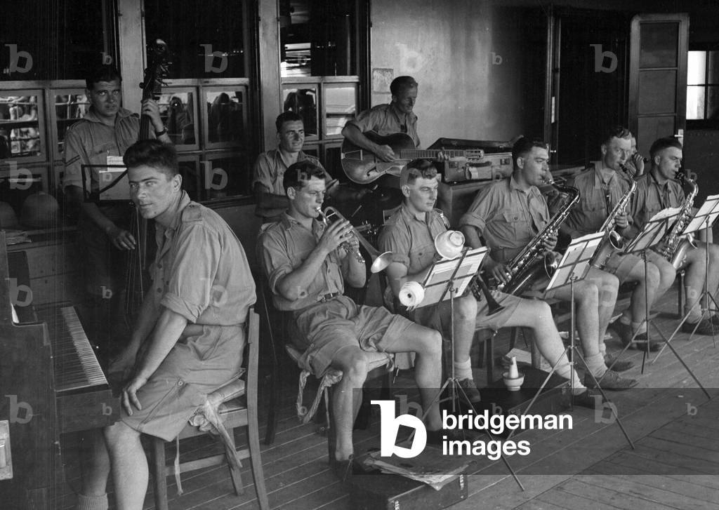 Regtl Dance band, 3rd County of London Yeomanry (Sharpshooters), on board HMT Orion, en route to Egypt, 1941 (b/w photo)