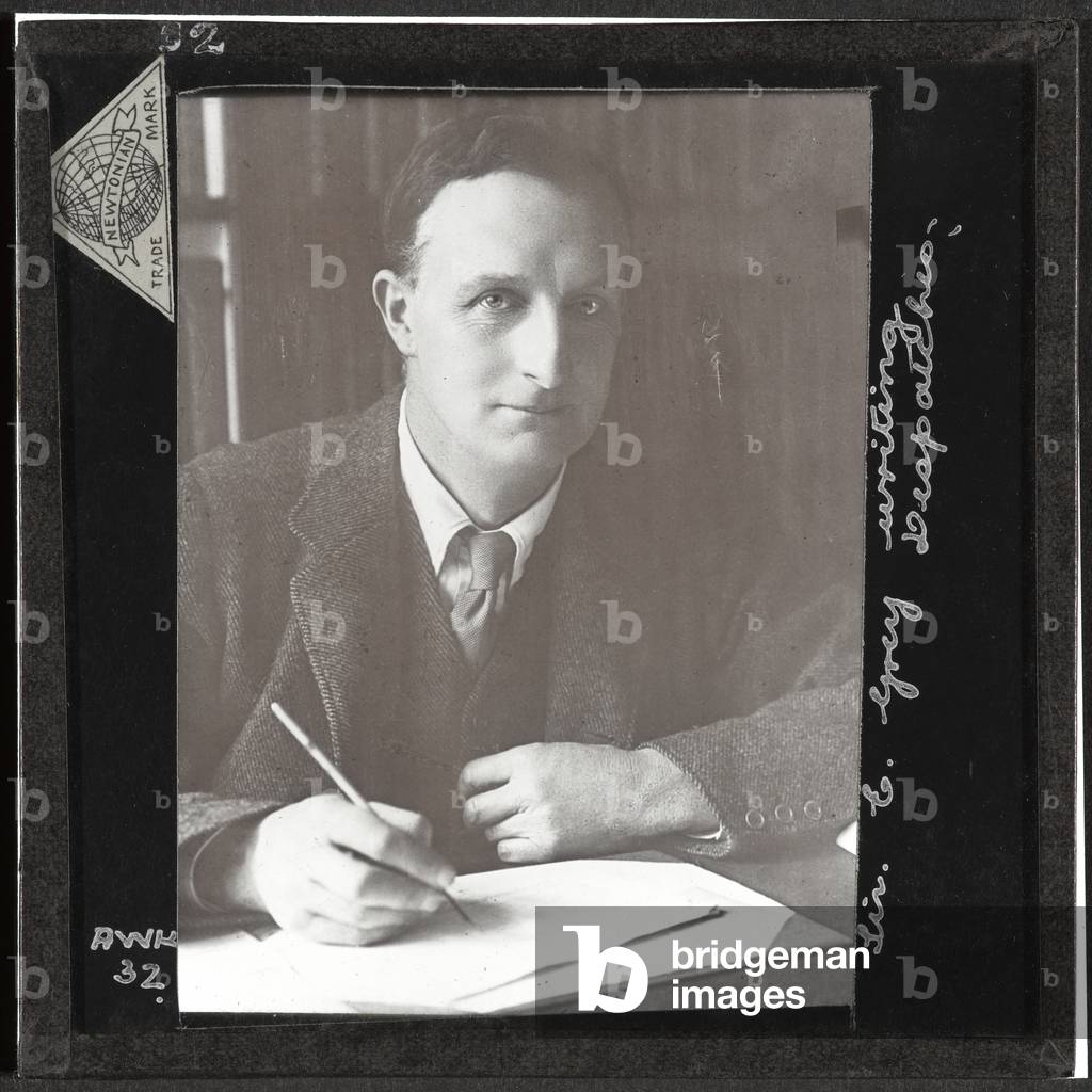 Sir Edward Grey writing despatches, 1914 (lantern slide)