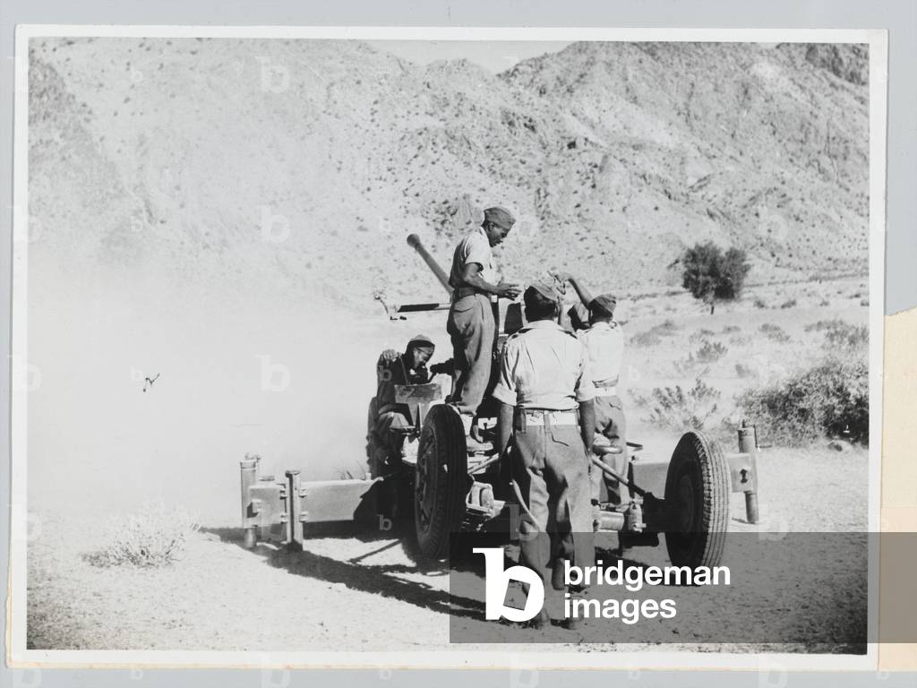 Mahratta gunners of an Indian Anti-Aircraft Battery giving a demonstration, 1944 (b/w photo)