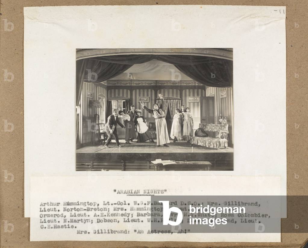 A scene from Arabian Nights, featuring Lieutenant E. Knight as Mrs Hummingtop, 1918 (b/w photo)