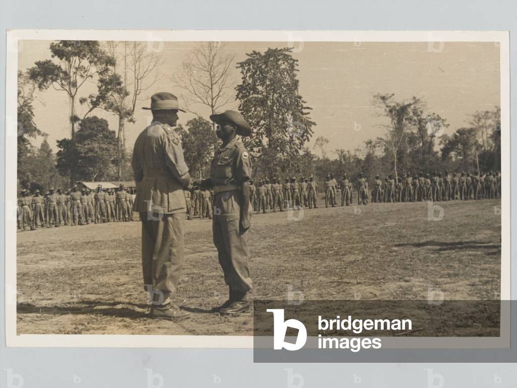 General Slim presenting awards to the 1st Northern Rhodesian Regiment and the 2nd Battalion Kings African Rifles, 1944 circa (b/w photo)