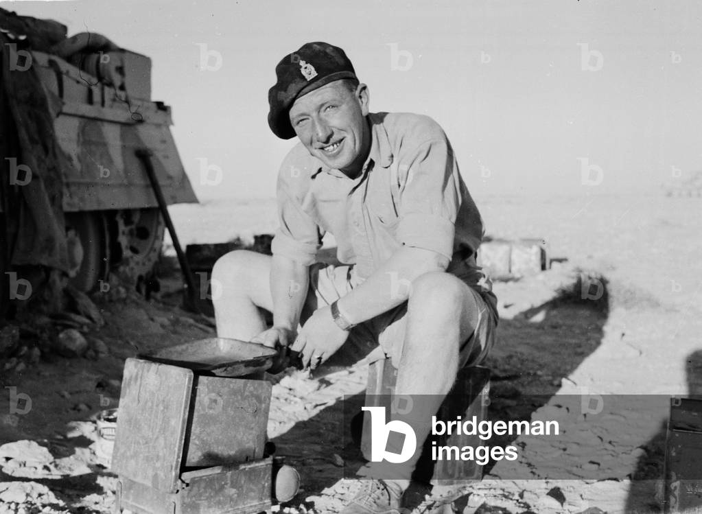 Cooking in the desert, North Africa, 1942. (b/w photo)