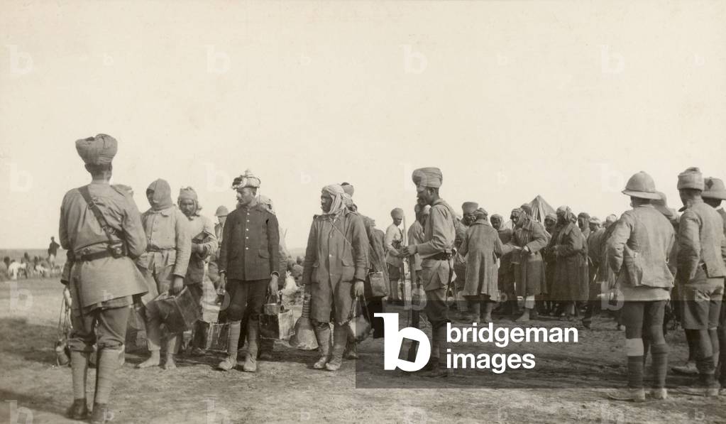 Turkish prisoners drawing water, 10 January 1916 (b/w photo)
