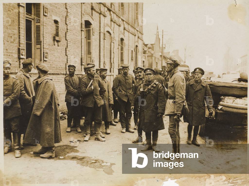 The German offensive. German prisoners resting in a small village, 1918 (b/w photo)