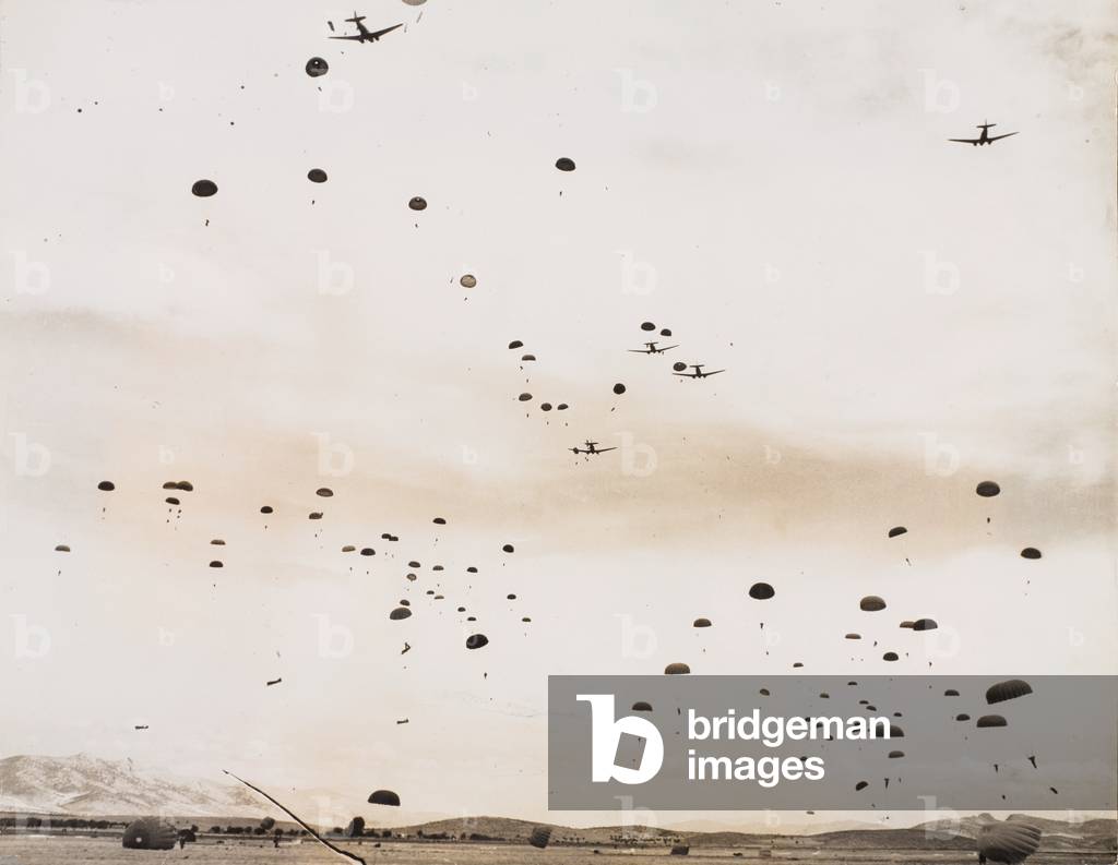 British paratroopers dropping from Dakota aircraft onto an airfield near Athens, 14 October 1944 (b/w photo)