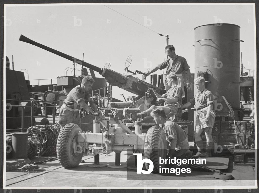 Bofors guns on the upper deck of a Landing Ship Tank (LST), Sousse harbour, July 1943 (b/w photo)