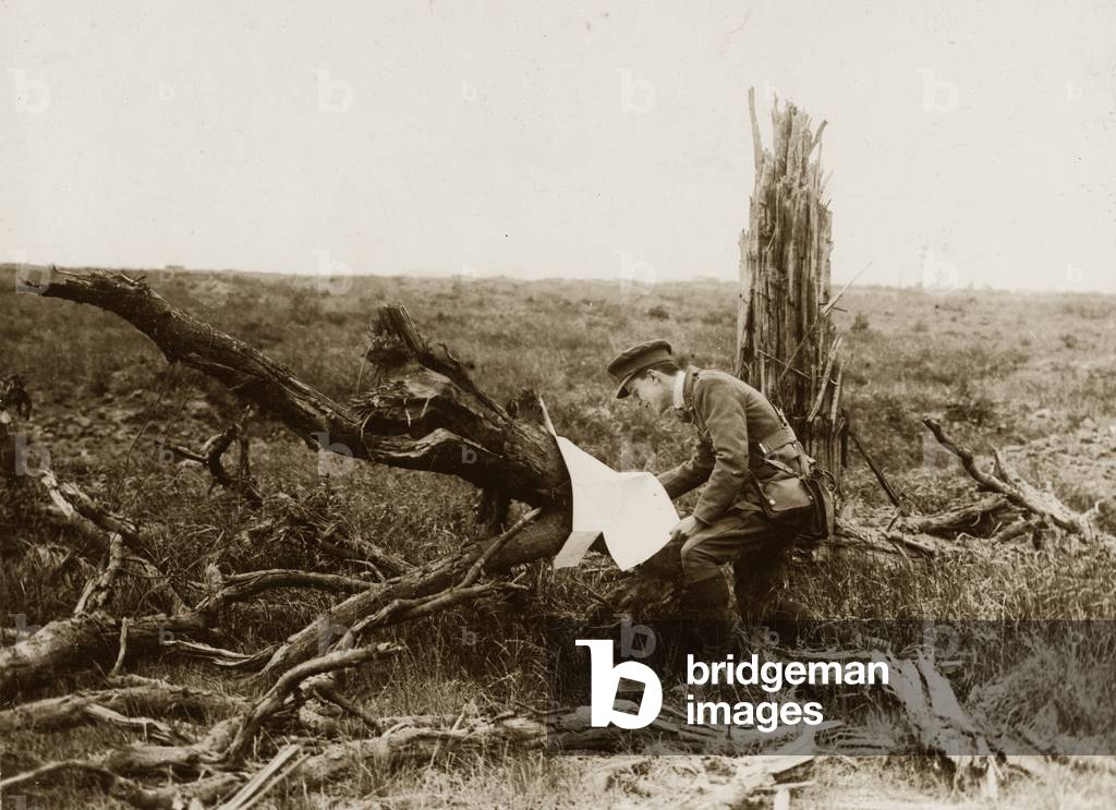 Battle of Messines Ridge. An officer finds a German map, 1917 (b/w photo)