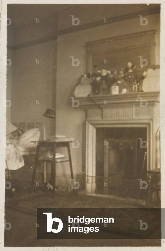 A wounded soldier in bed at Endsleigh Palace Hospital, September 1917 (b/w photo)