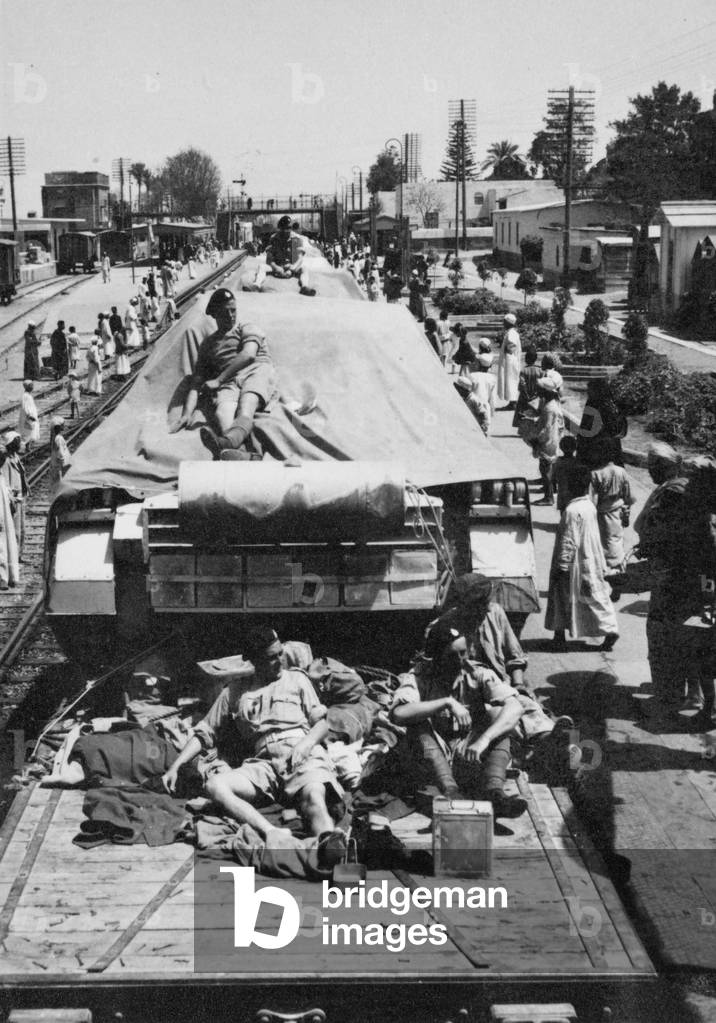 Tanks and crewmen of 3rd County of Yeomanry entraining at Giza, Egypt, 1942 (b/w photo)