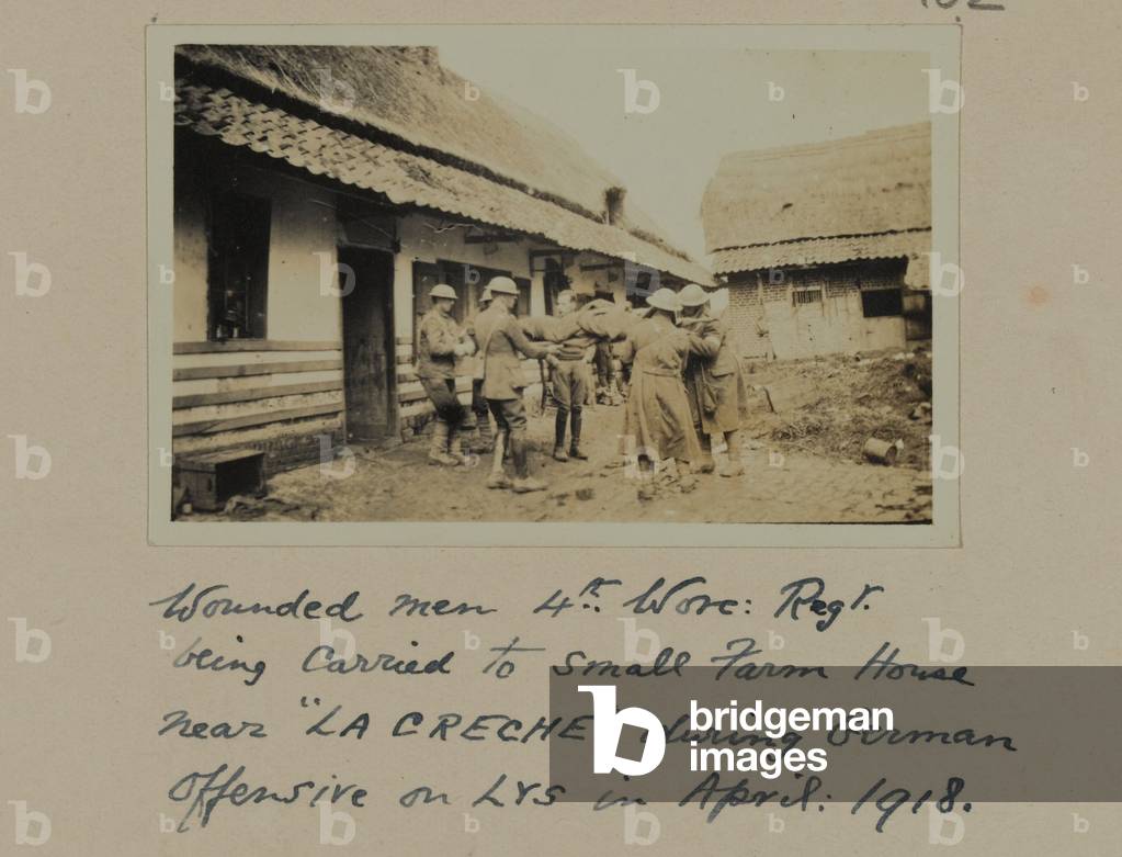 Wounded men, 4th, Worc: Regt. being carried to small farm house near “LA CRECHE” during German Offensive on LYS, April 1918 (b/w photo)