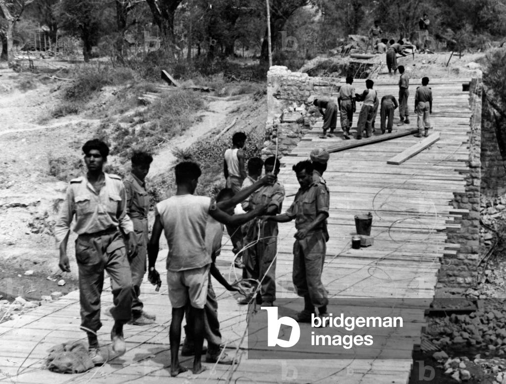 Indian troops repairing a bridge, Burma, 1945 (b/w photo)