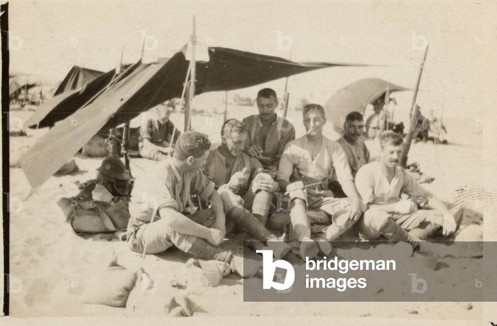 British soldiers sheltering from the sun under a canopy, Libya, 1916 (b/w photo)