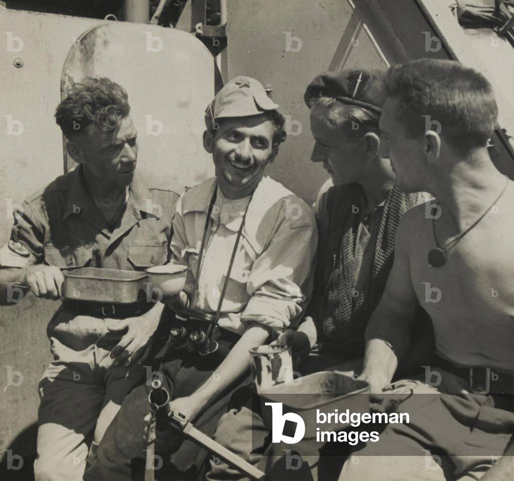 Men of No 2 Commando drinking tea with a Yugoslav partisan, 1944 (b/w photo)