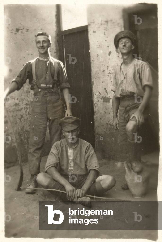 Three British soldiers posing with sticks and a jug, c.1916 (b/w photo)