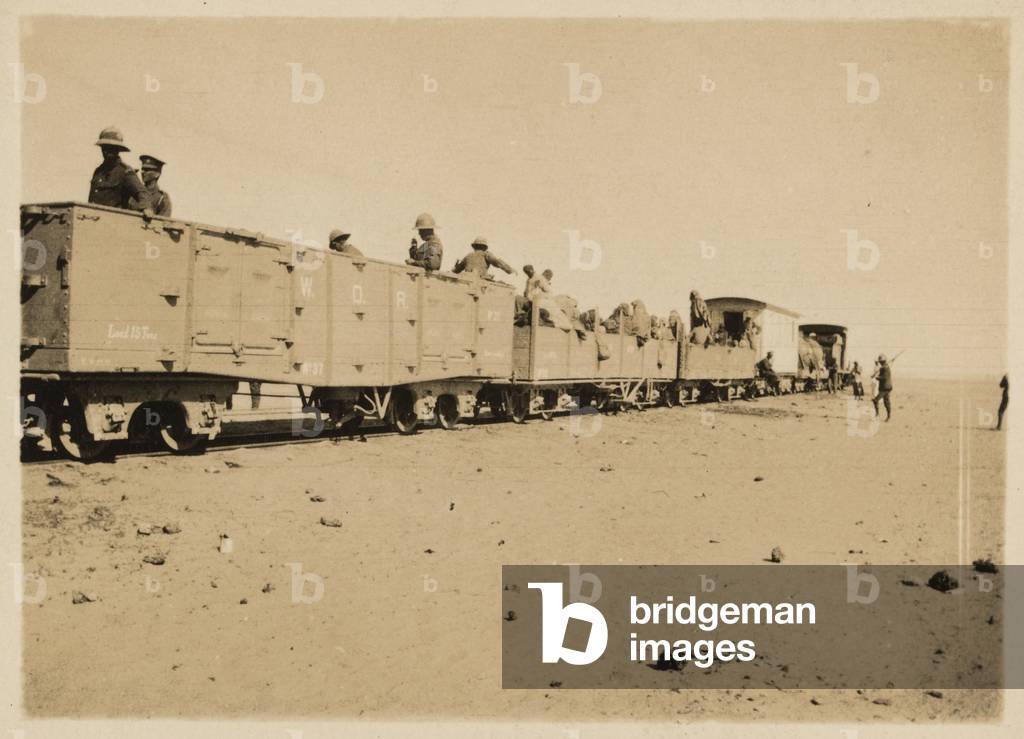 British Soldiers and Senussi refugees on the desert railway, 1916 (b/w photo)