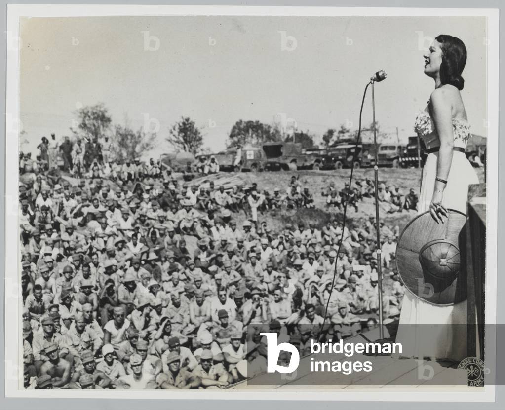 Lily Pons singing at Bomb Crater theatre, Bhamo, Burma, February 1945 (b/w photo)