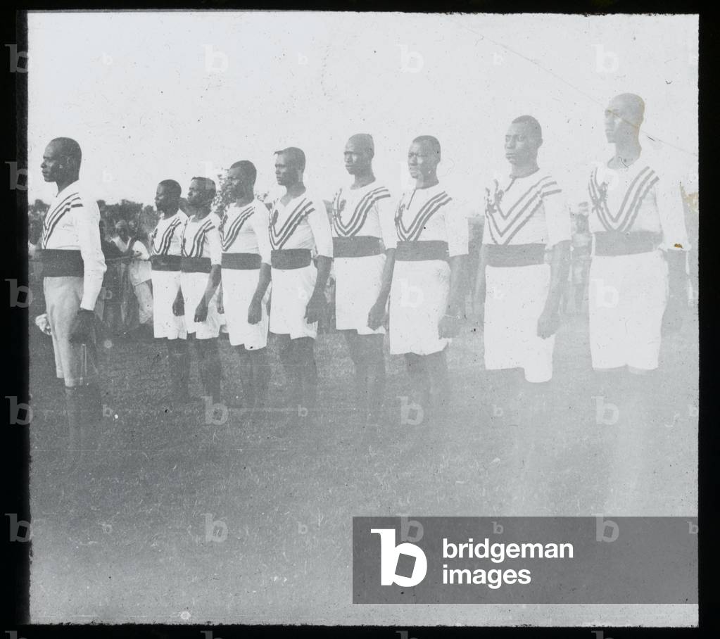 Soldiers of the Northern Nigeria Regiment parade in sports drill, 1907 circa (lantern slide)