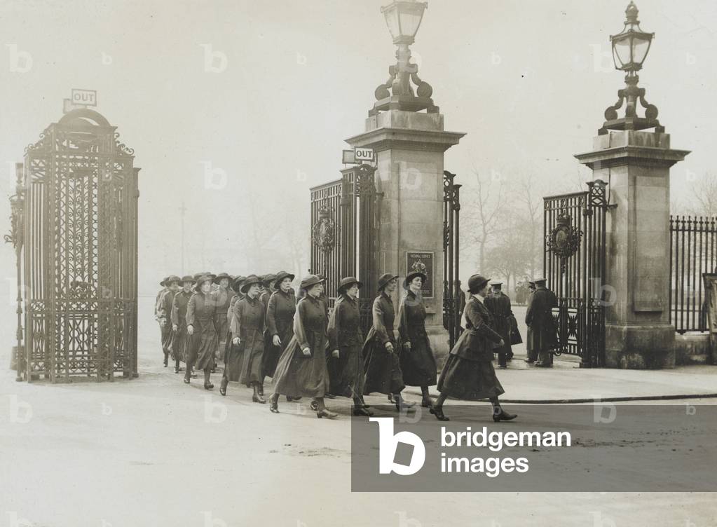 Women’s Army Auxiliary Corps marching through iron gates, 1917-18 (b/w photo)