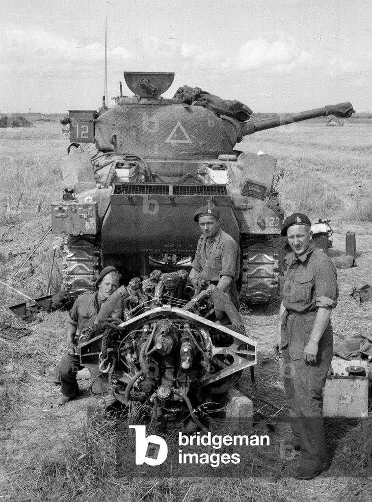 100-hour engine check - Ronnie Grant, Sid Hicks and Topper Brown, 3rd County of London Yeomanry (Sharpshooters), Normandy, 1944 (b/w photo)