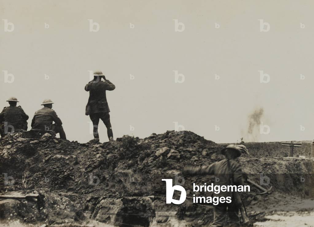 Troops observing a bombardment, 1917-18 (b/w photo)