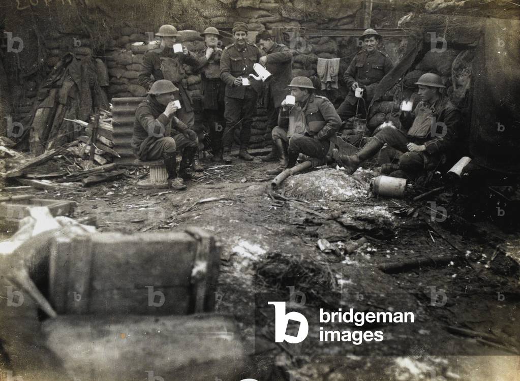 British officers and men enjoy a cup of tea in their trench, 1918 (b/w photo)