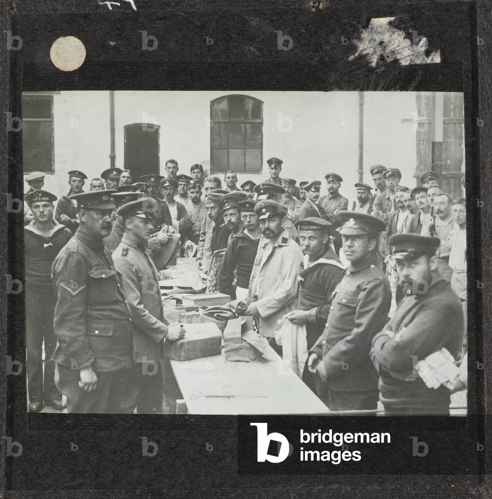German prisoners receiving parcels from Germany at Handforth Camp in Cheshire, 1917 (lantern slide)