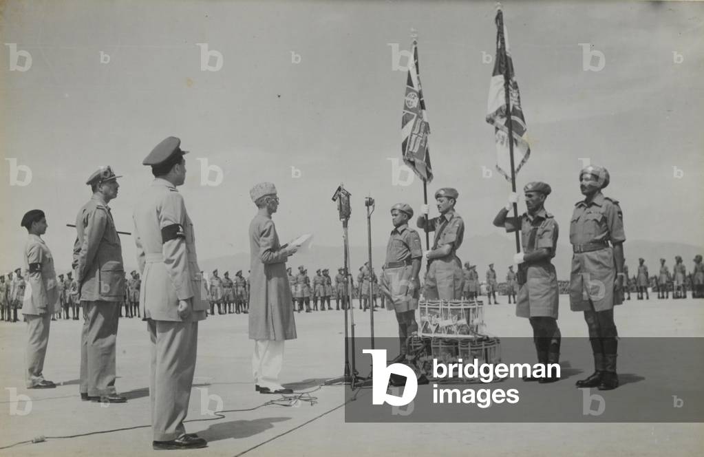 The presentation of colours to the 2nd Bn, 15th Punjab Regiment by Mohammad Ali Jinnah Qaid-i-Azam, Peshawar, Pakistan, 15 Apr 1948 (b/w photo)