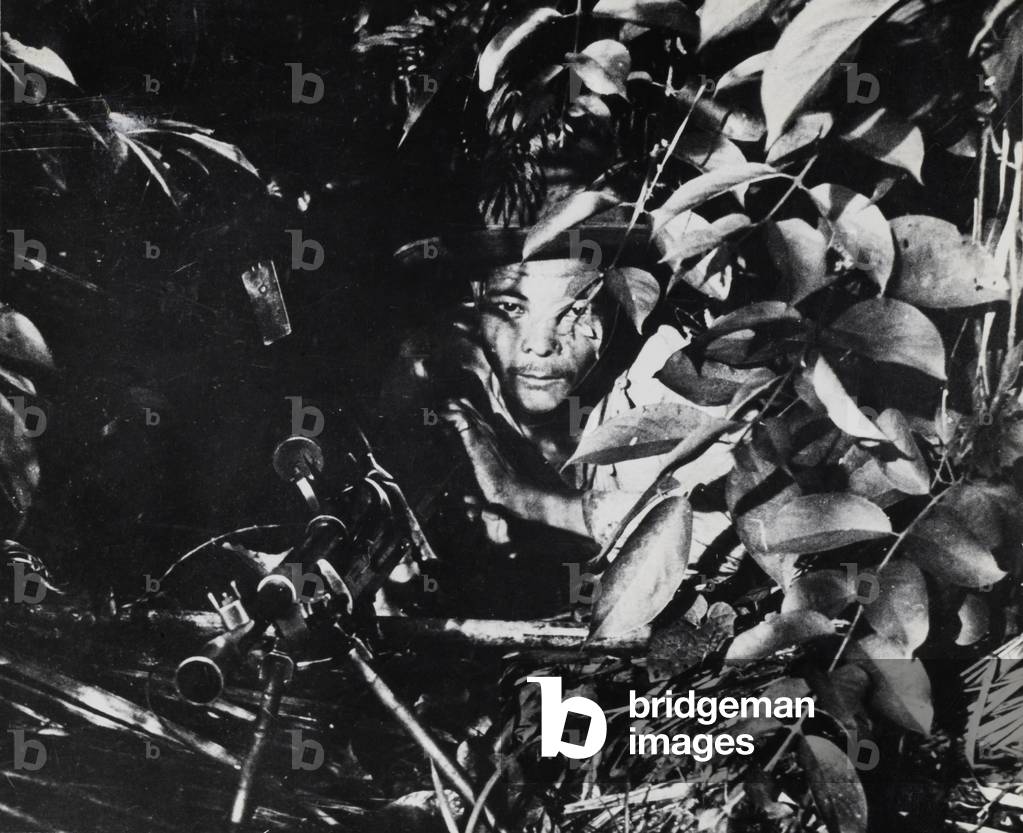 A well-concealed Bren Gunner of the 7th Gurkha Rifles amongst the thick foliage of the Burmese jungle, c.1944 (b/w photo)
