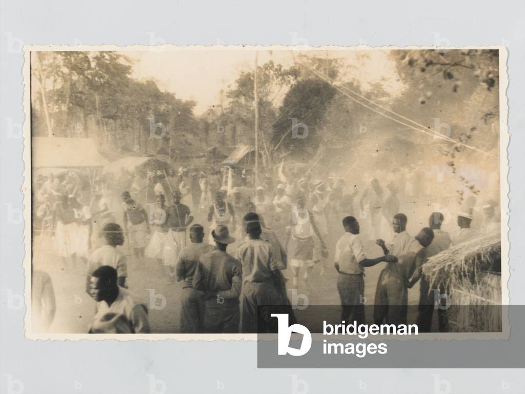 Men of 4th (Uganda) Battalion, Kings African Rifles, celebrate the end of the Second World War, 1945 (b/w photo)