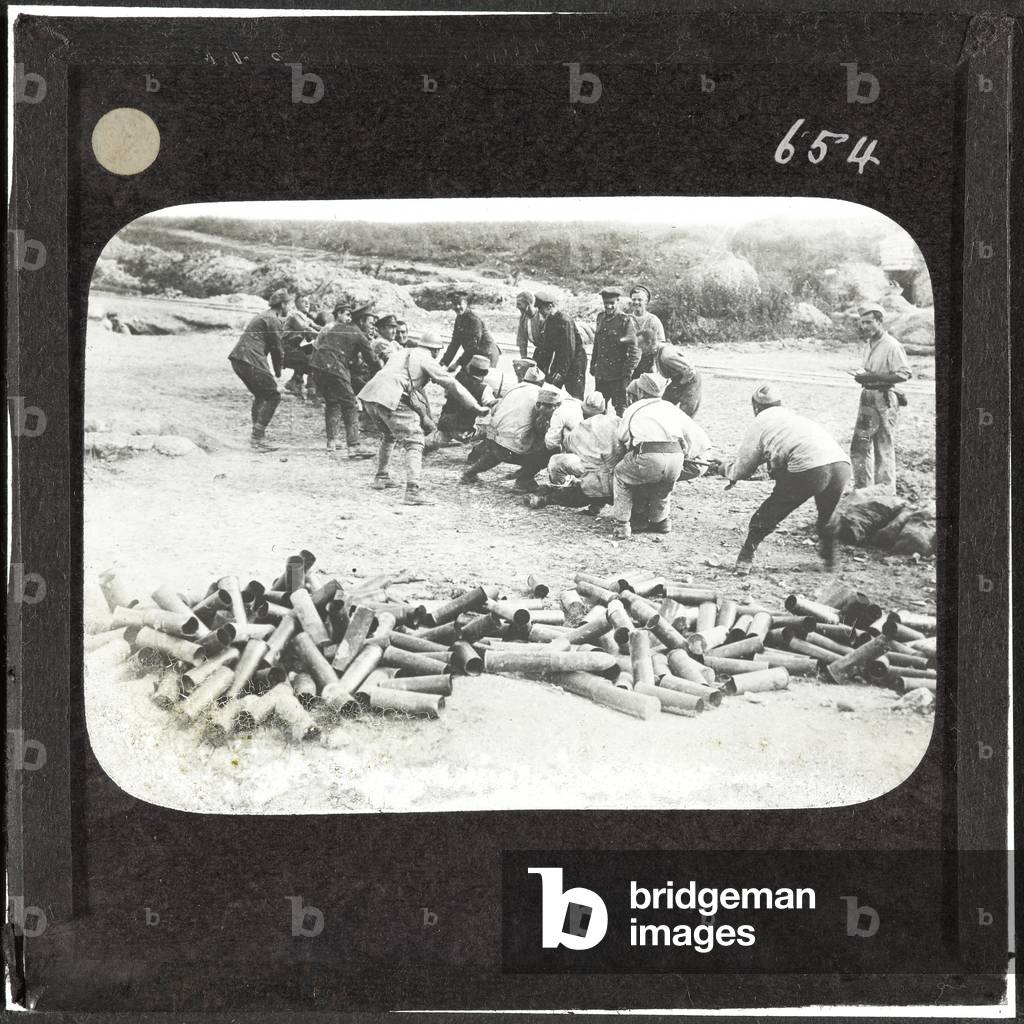 A tug-of-war between British and French troops, September 1916 (lantern slide)
