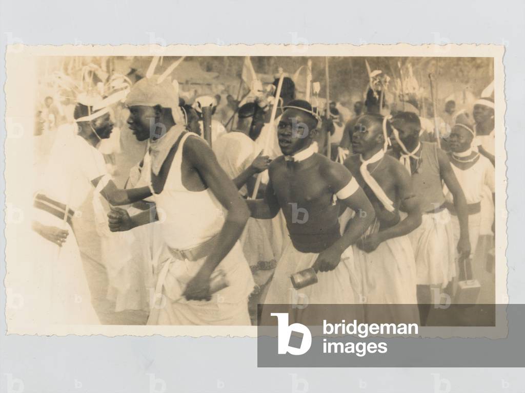 A traditional dance by members of the 4th (Uganda) Battalion, Kings African Rifles, 1945 (b/w photo)