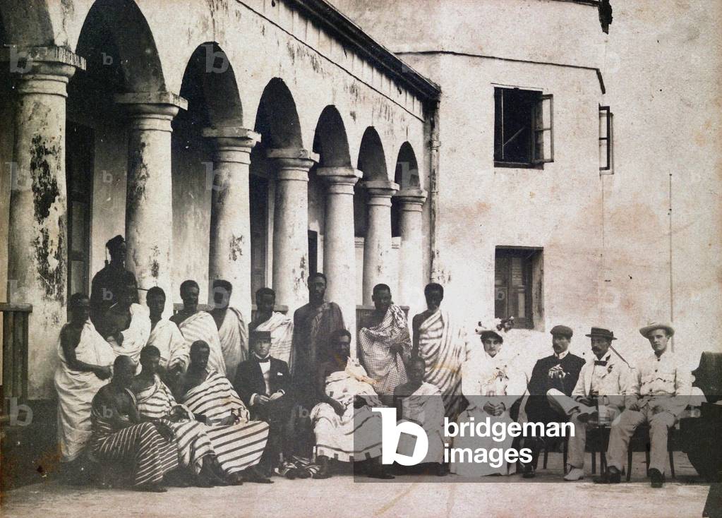 King Prempeh and court with Dr de Groot and Mrs de Groot at Gold Coast castle, 1895 circa (b/w photo)