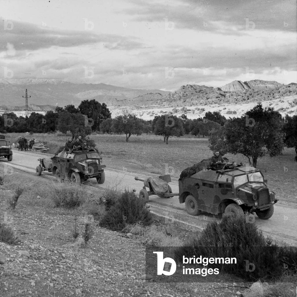 Anti-tank guns moving up to the Tunisian front line, 1943 (lantern slide)