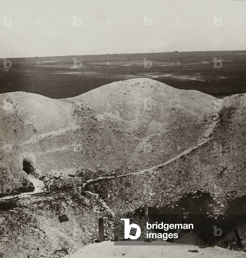 Looking into the depths of the tremendous crater of our mine fired at La Boiselle on the Somme, c.1916 (b/w photo)