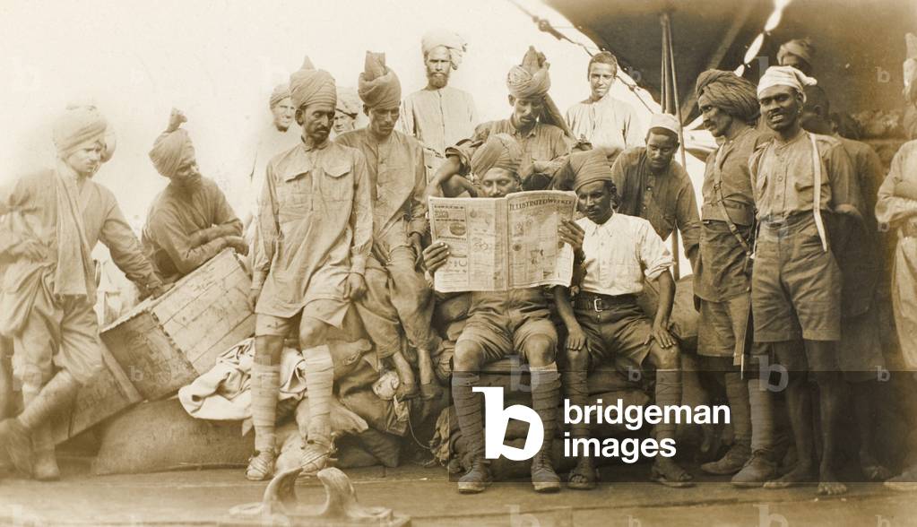 Indian Army troops travelling upstream on a barge, Mesopotamia, 1916 circa (b/w photo)