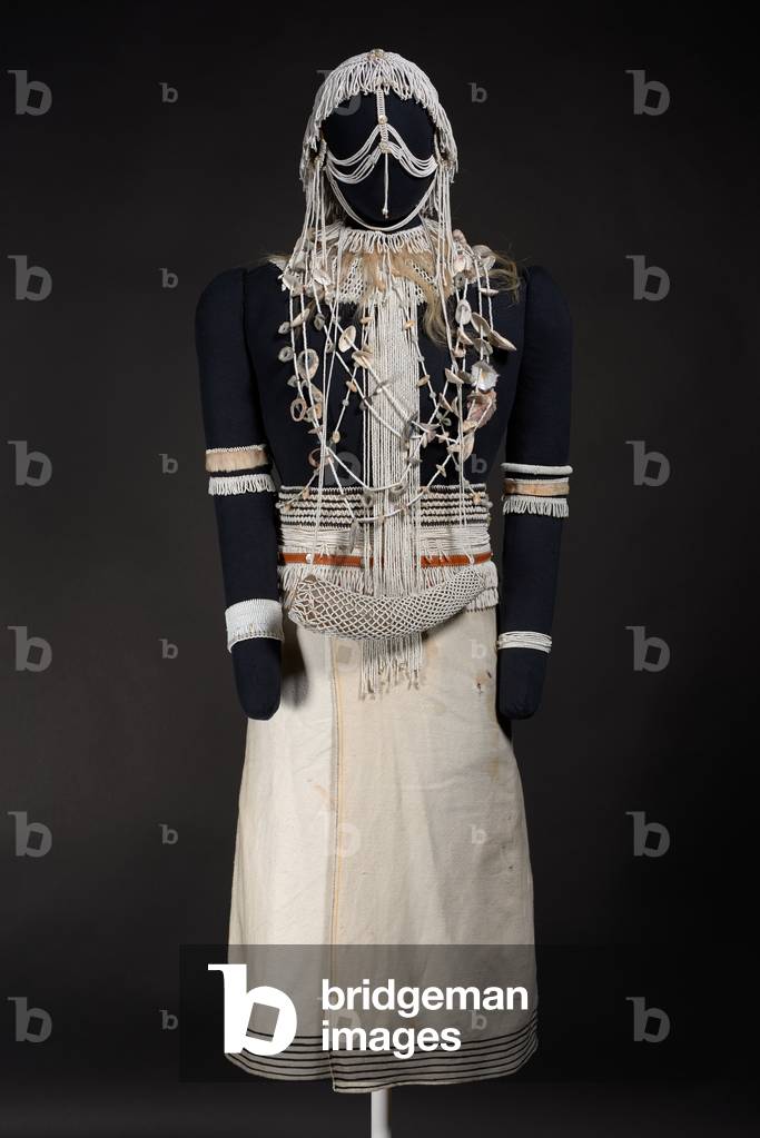 Costume for a Diviner's Acolyte (umkhwetha), before 1966 (cloth, glass beads, shells, goat skin, goat gall bladder, cowhide, cow horn, brass, plastic, leather, wood, mother-of-pearl buttons)