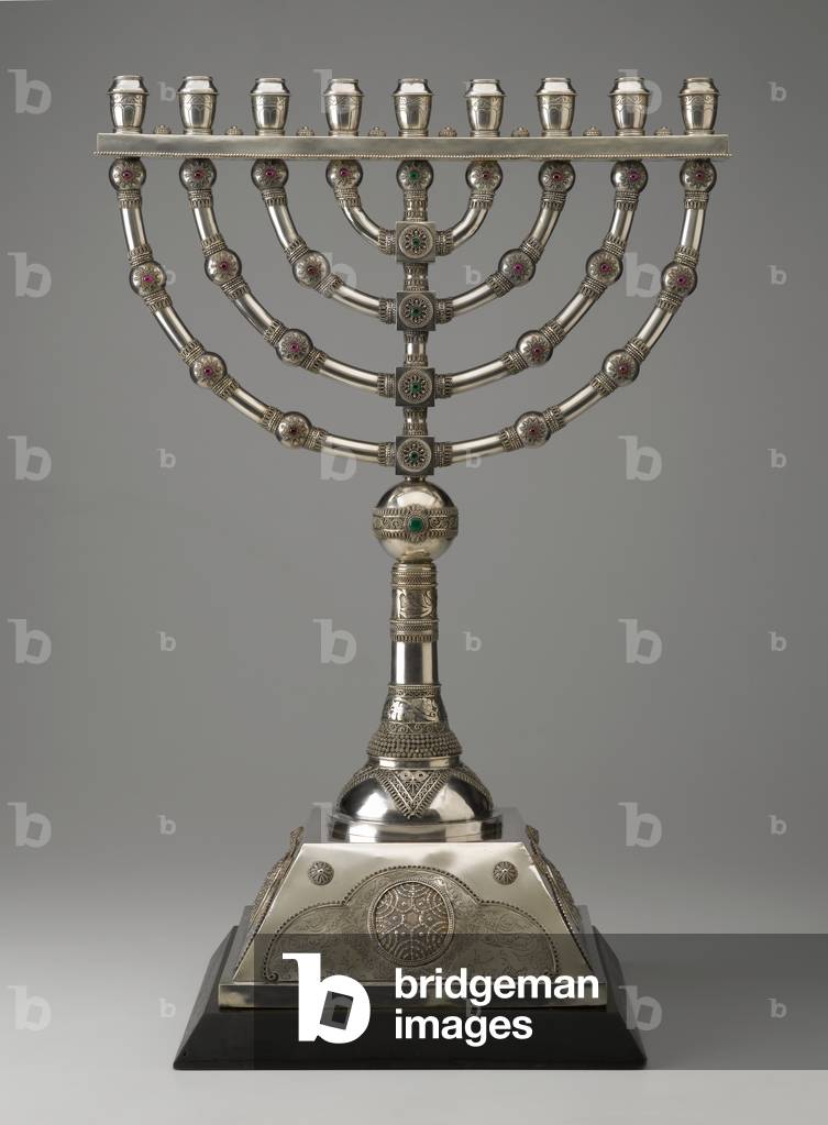Standing Hanukkah Lamp, Designed c. 1926, fabricated late 1920s (silver: repoussé and etched, filigree, inset with colored glass; wood base)