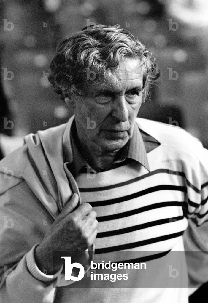 Michael Tippett holding jacket