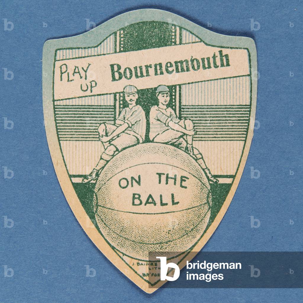 'Play Up Bournemouth', Baines' card in the shape of a shield and two footballers sitting on top of a large football, 1888-89 (colour litho)