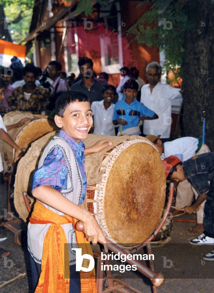 Indian boy playing Dhol