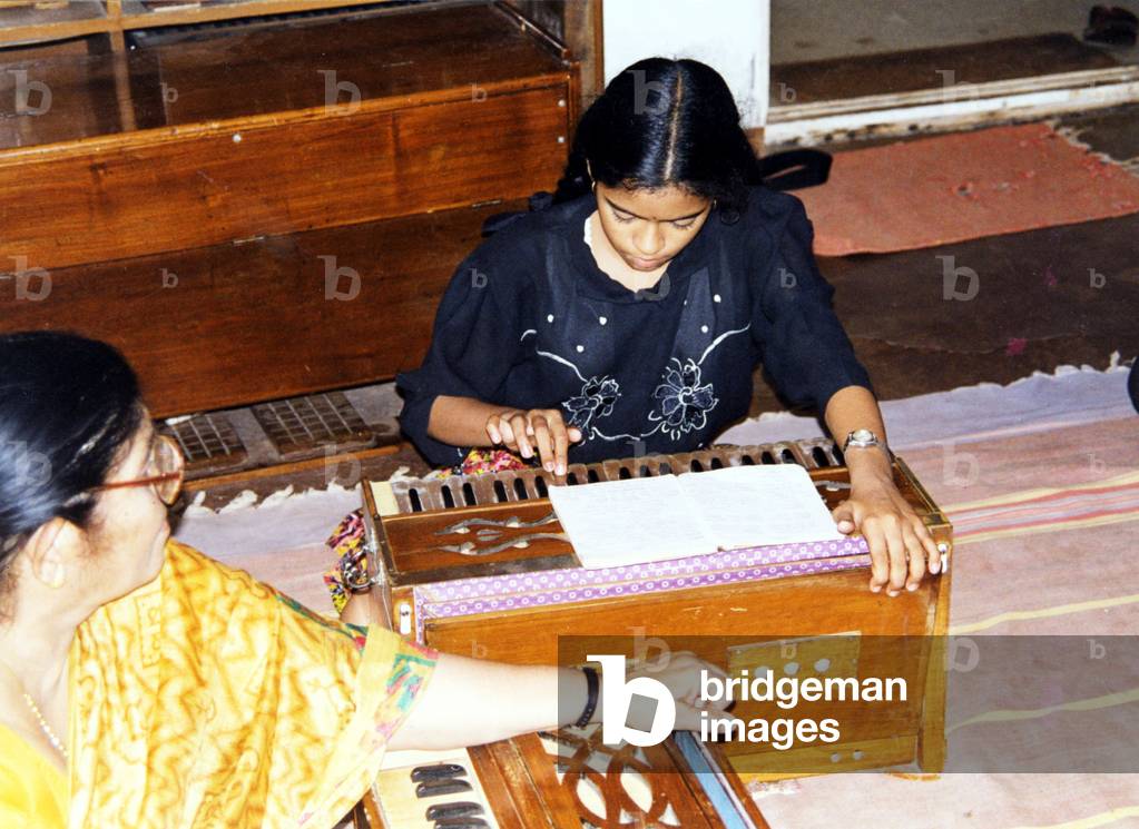 Harmonium being played Aerophonic